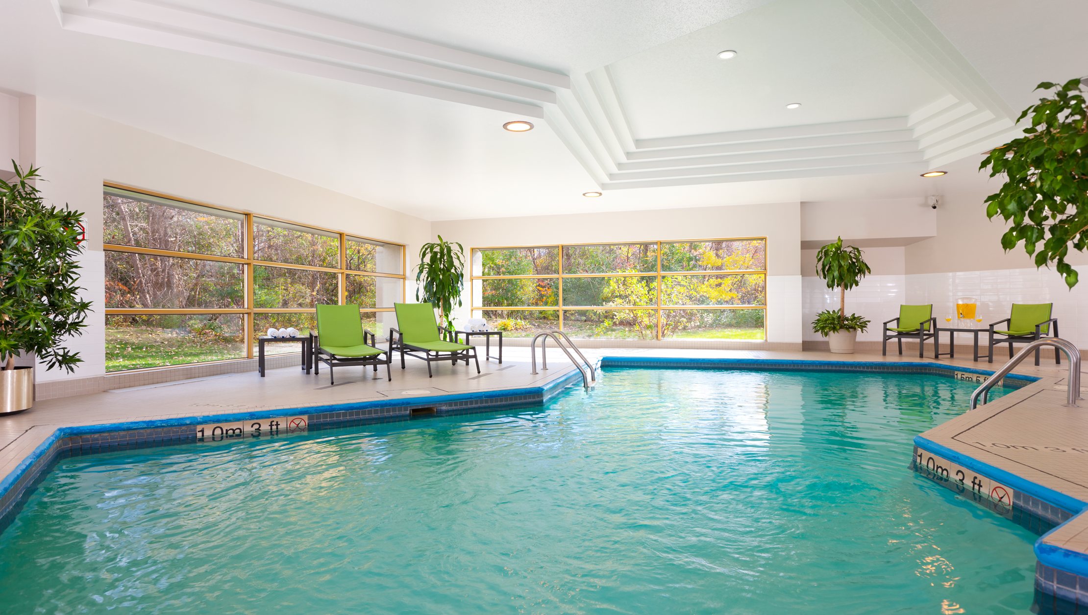 Photo of Holiday Inn Laval indoor pool with surrounding windows to exterior