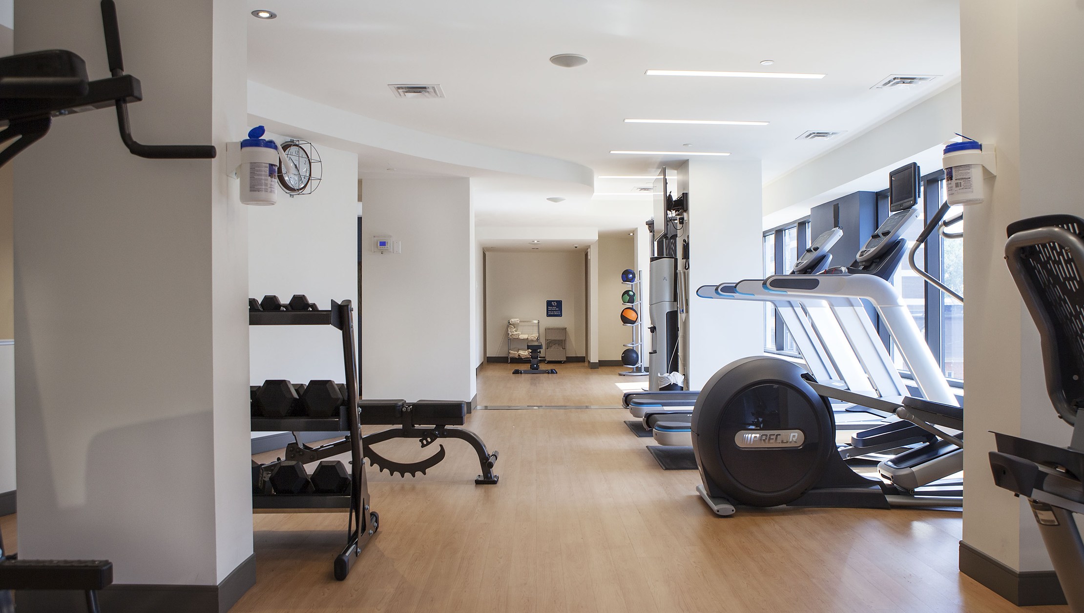 Photo of Les Suite Ottawa indoor fitness centre with free weights and treadmill equipment