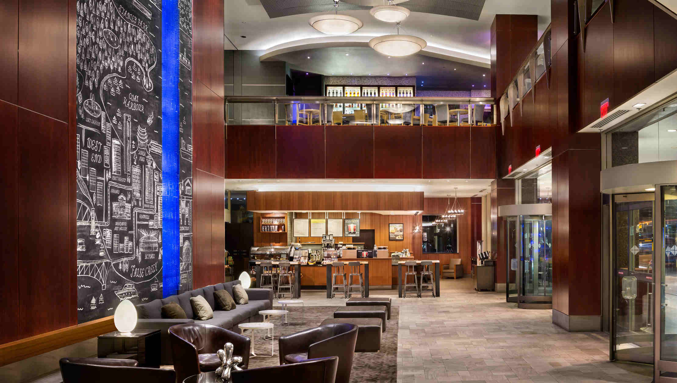 Photo of Hyatt Regency Vancouver lobby with overlooking bar, lounge and breakfast area